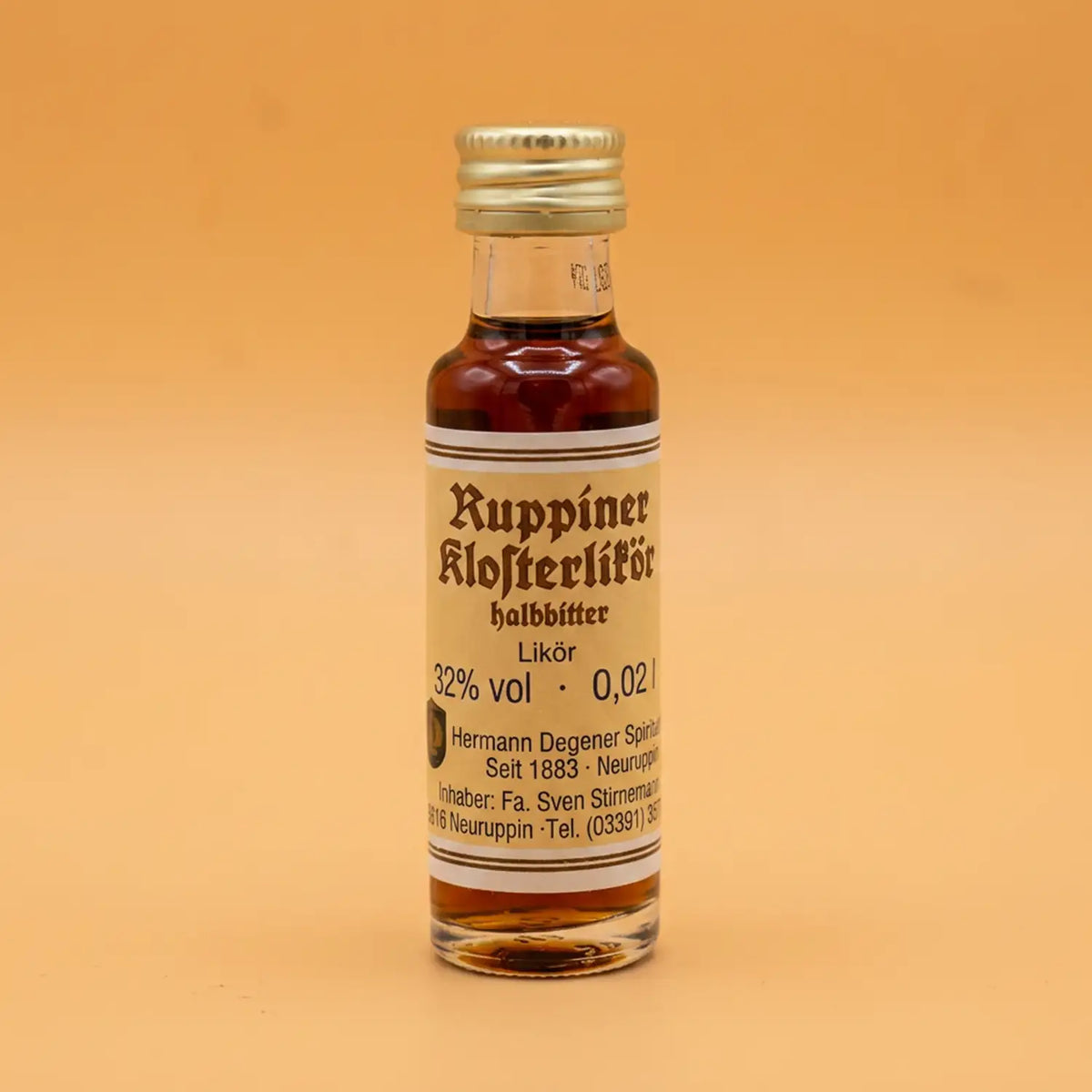 neuruppin-ruppiner-klosterlikoer-20ml-Vorderseite-mitorangepastelHintergrund